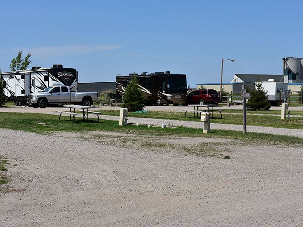 View of RV sites along with buildings in background at GOVERNORS' RV PARK CAMPGROUND