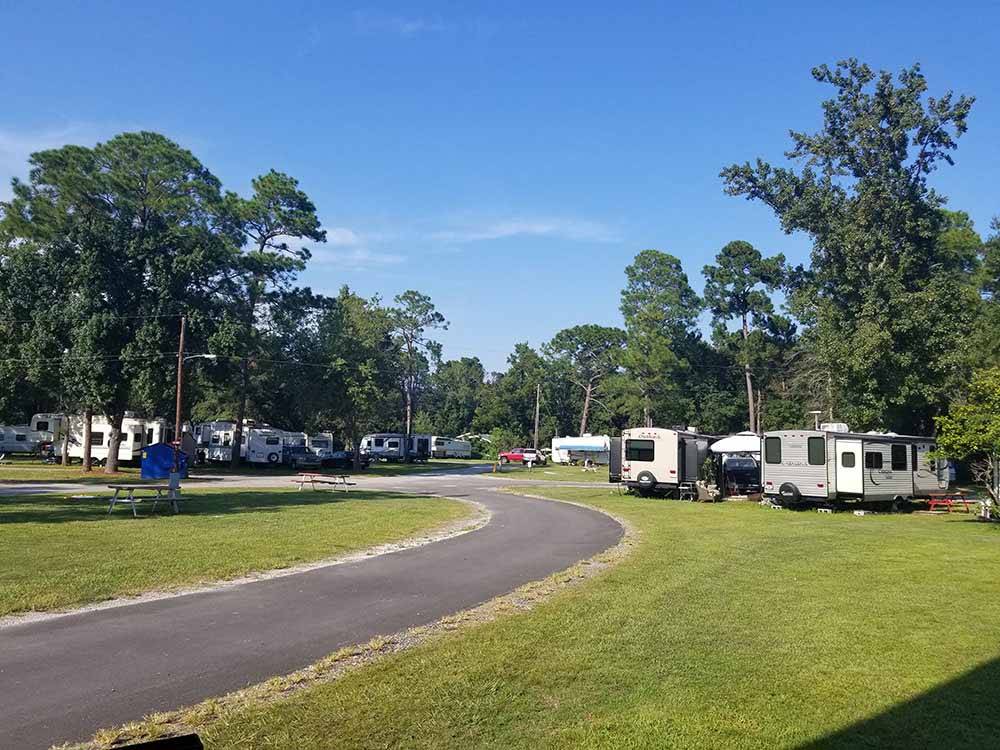 A paved road leading to the RV sites at SOUTHERN RETREAT RV PARK