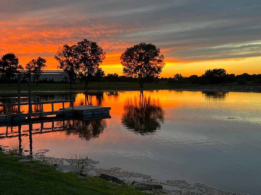 Sun setting over the pond at BAILEY'S RV RESORT