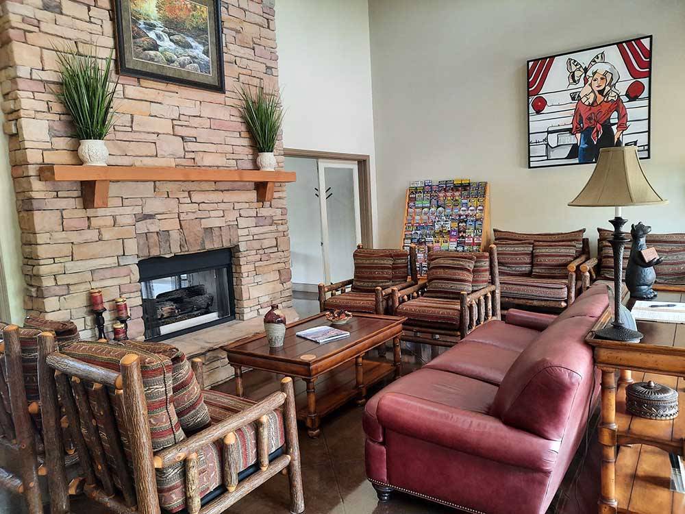 A seating area by the fireplace at TWO RIVERS LANDING RV RESORT