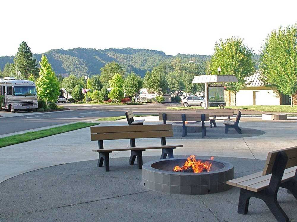 Patio area with picnic tables at SEVEN FEATHERS RV RESORT