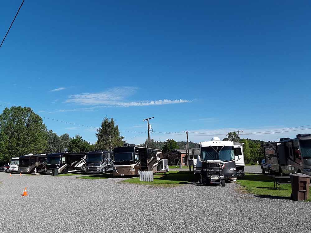 A row of gravel RV sites at OLD WEST RV PARK