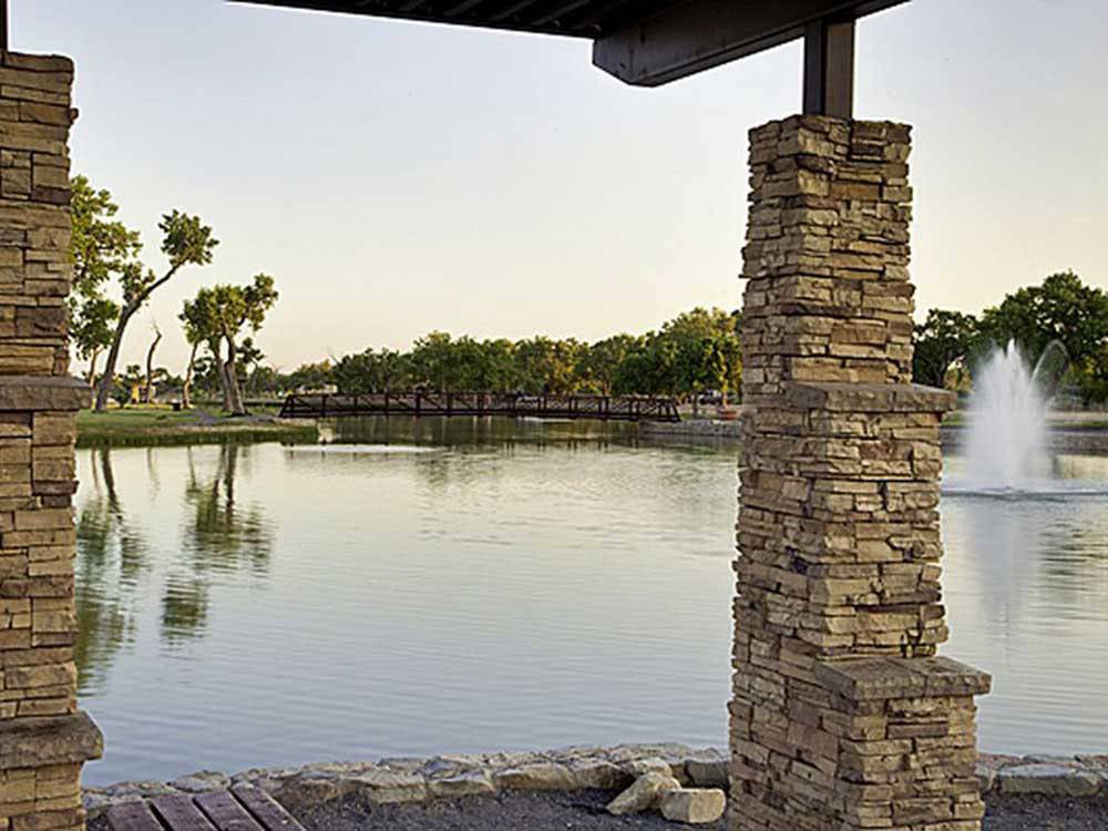 Lighted fountain in the lake at dusk at ISLETA LAKES & RV PARK