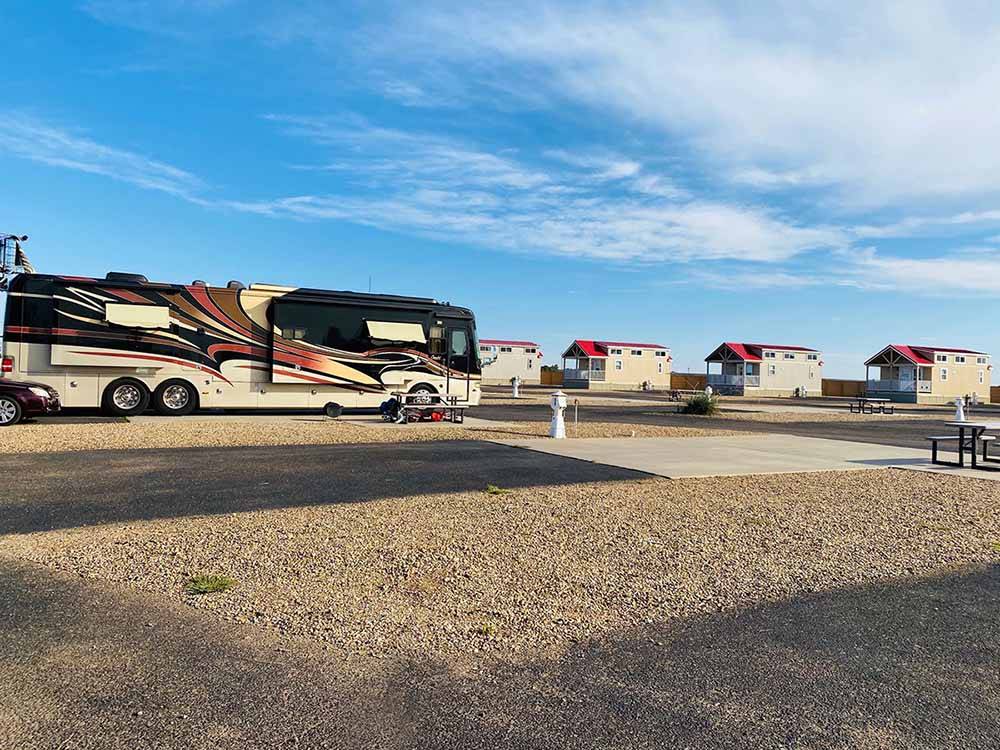 One of the empty paved pull thru RV sites at OASIS RV RESORT