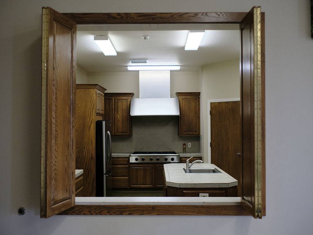 A window to the kitchen at BAKERSFIELD RIVER RUN RV PARK