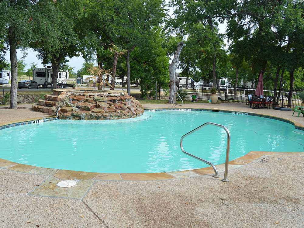 The pool with a waterfall at OAK CREEK RV PARK