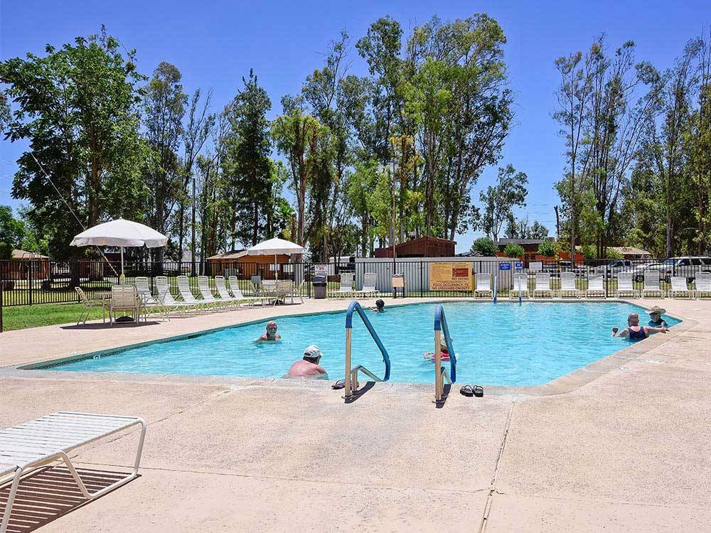 People swimming in the pool at THOUSAND TRAILS WILDERNESS LAKES RV RESORT