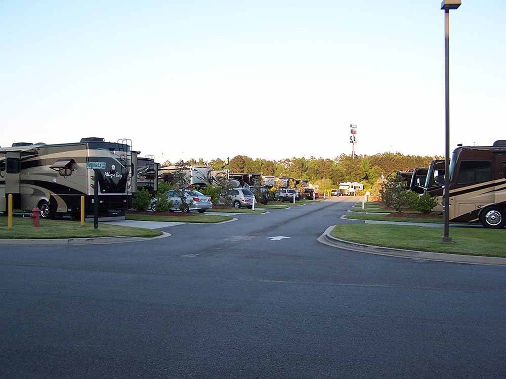 A paved road running by some RV sites at COASTAL GEORGIA RV RESORT