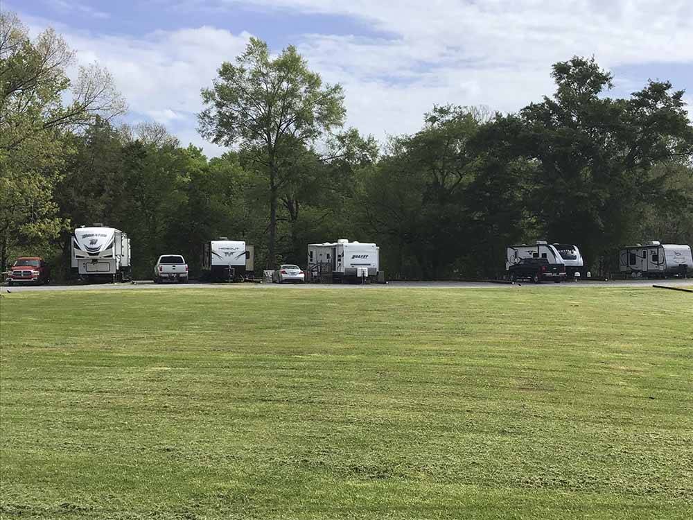 A grassy area by the RV sites at CEDAR CREEK RV & OUTDOOR CENTER