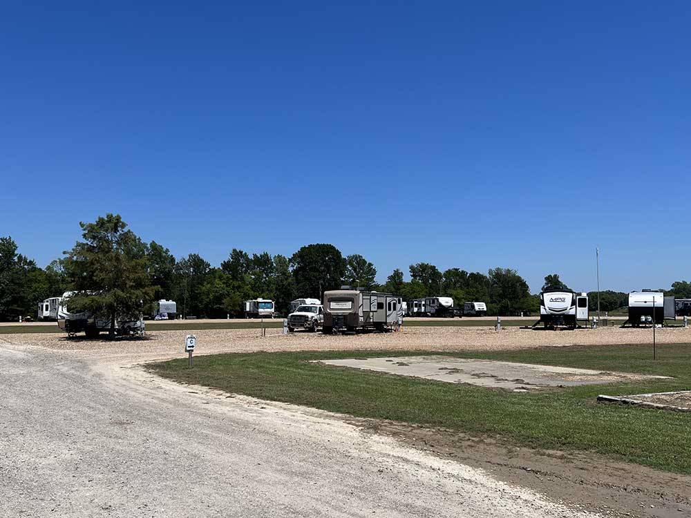 Road leading to open and occupied RV sites at SUNRISE RV PARK