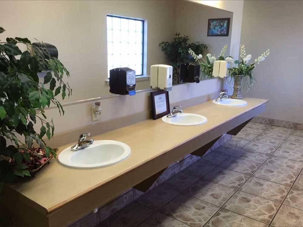 Clean sinks in public bathrooms at SUNRISE RV PARK