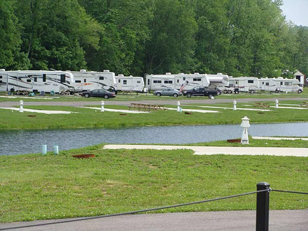 Trailers camping on the water at FOLLOW THE RIVER RV RESORT