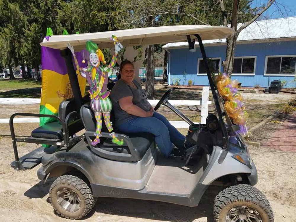 A golf cart decorated for Mardi Gras at ATLANTIC BLUEBERRY RV PARK