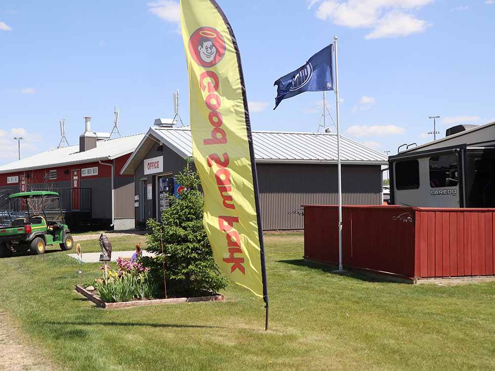 Lawn and houses with flag at ST. ALBERT RV PARK