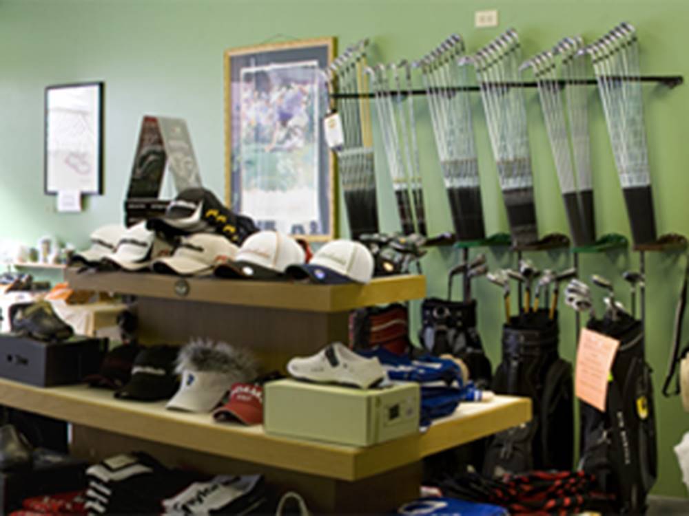 Hats and clubs on display at RIVERSIDE GOLF & RV PARK