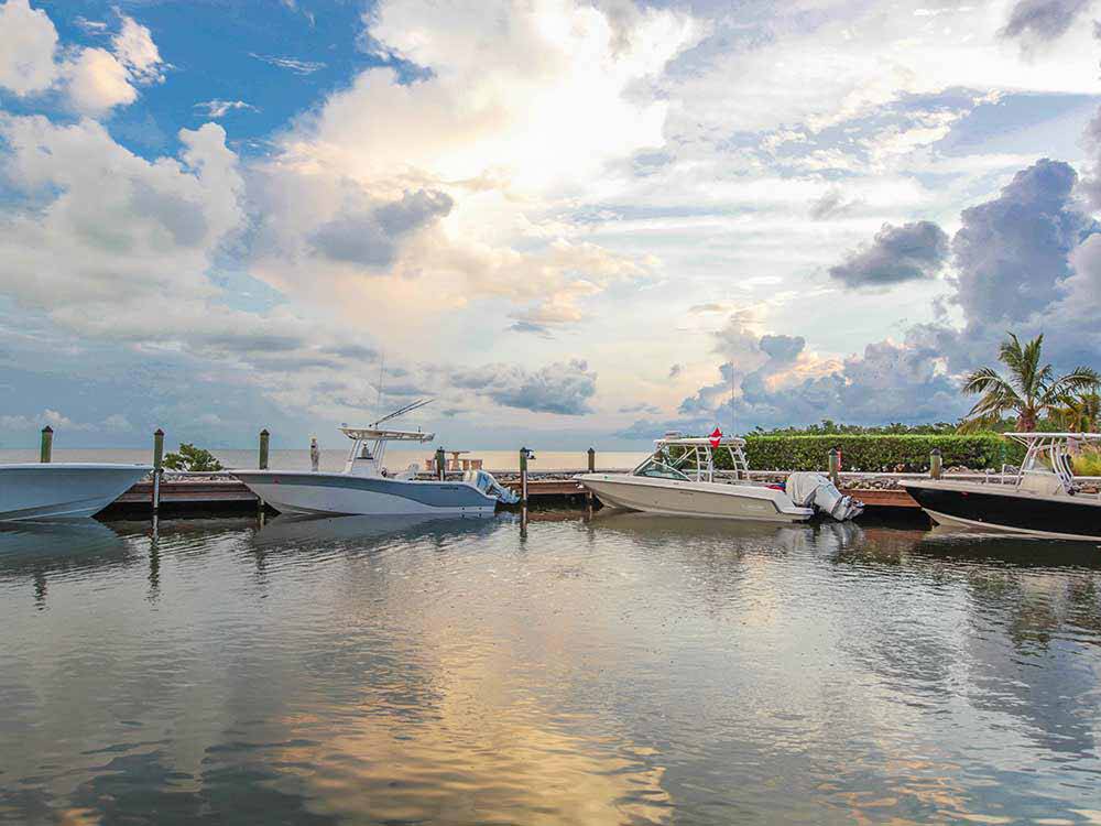 Boats at the dock and beautiful blue sky at dusk at GRASSY KEY RV PARK AND RESORT