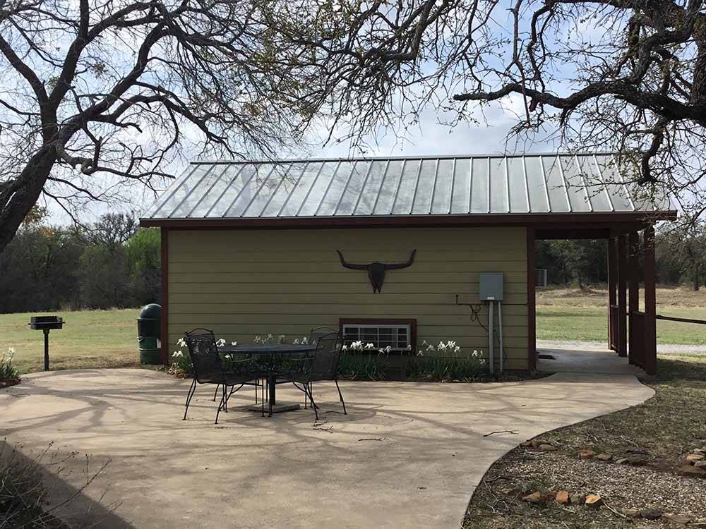 Cabin with outdoor seating area at COFFEE CREEK RV RESORT & CABINS