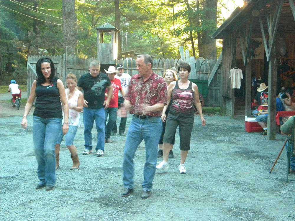 A group of people dancing at CIRCLE CG FARM CAMPGROUND
