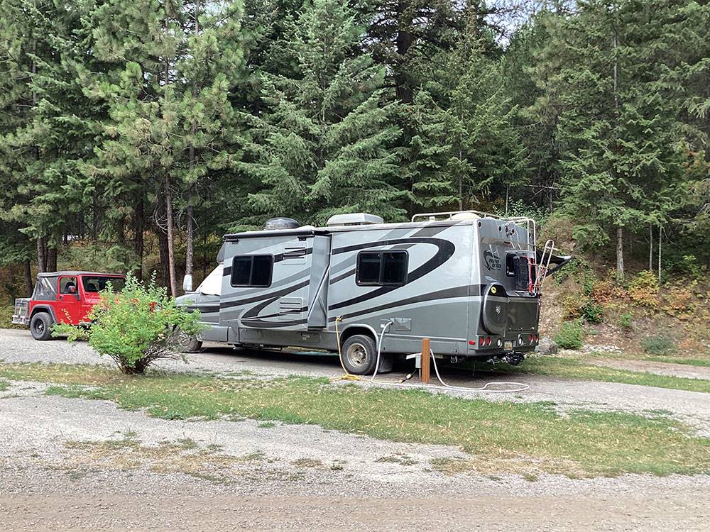 Class C motorhome and jeep in site at CAMPGROUND ST REGIS