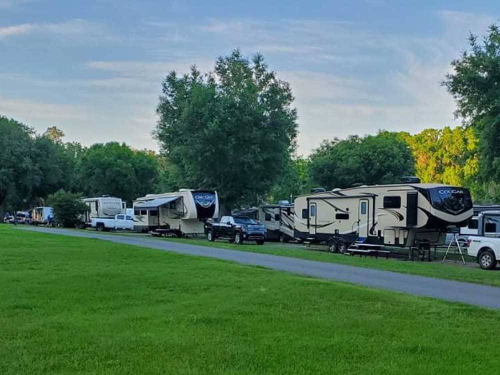 RVs parked at campground at TRAVELERS CAMPGROUND