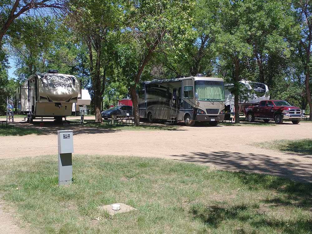 A dirt RV site with hookups at DAKOTA CAMPGROUND