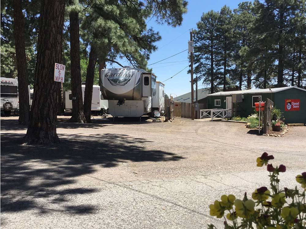 A fifth wheel trailer by the front office at FLAGSTAFF RV PARK