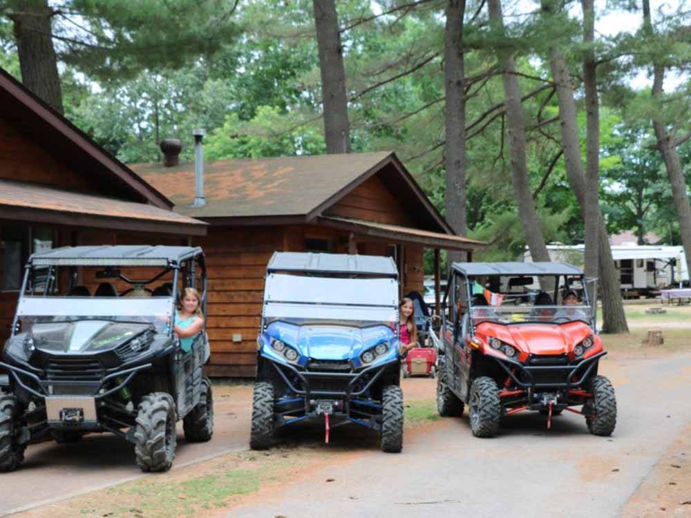Three ATVs in a line at SID TURCOTTE PARK CAMPING AND COTTAGE RESORT