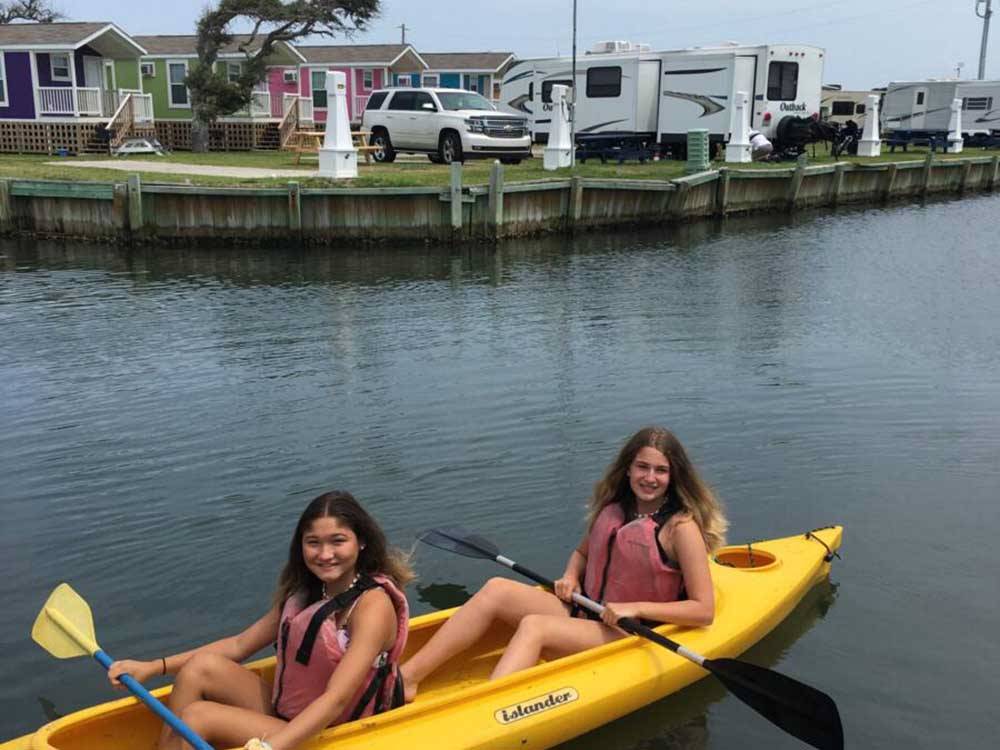 A couple of girls in a kayak at HATTERAS SANDS CAMPGROUND