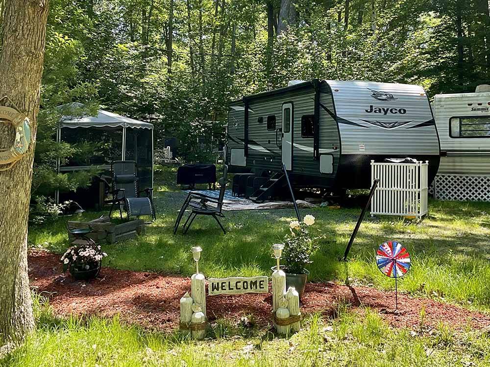 One of the RV sites under trees at TIDEWATER CAMPGROUND