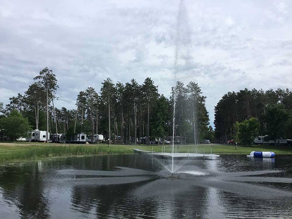 View of lake with fountain at STONY POINT RESORT RV PARK & CAMPGROUND