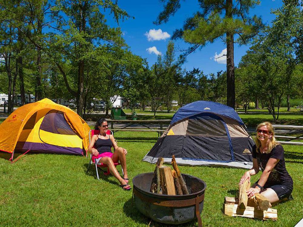 Girls in tents camping at HOLIDAY TRAV-L-PARK