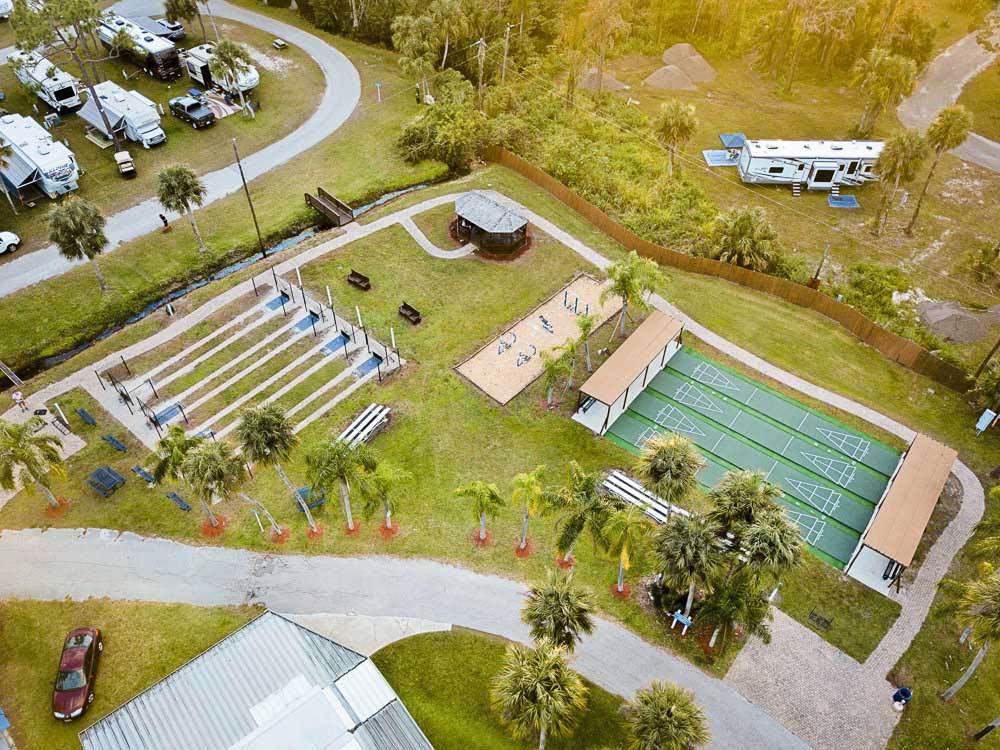Aerial shot of four shuffleboard courts and RV campground at BLUEWAY RV VILLAGE