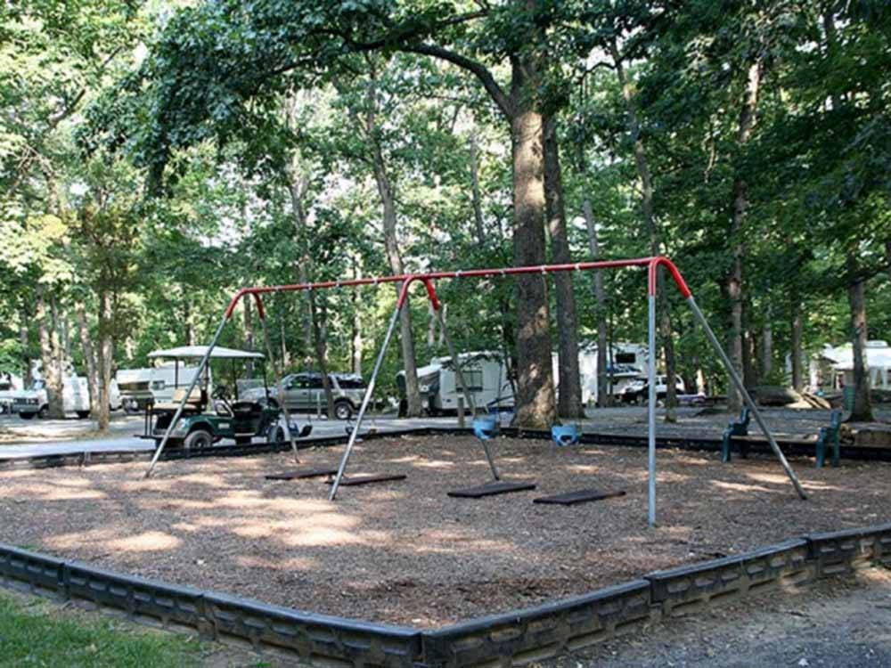 The playground area with swings at DRUMMER BOY CAMPING RESORT