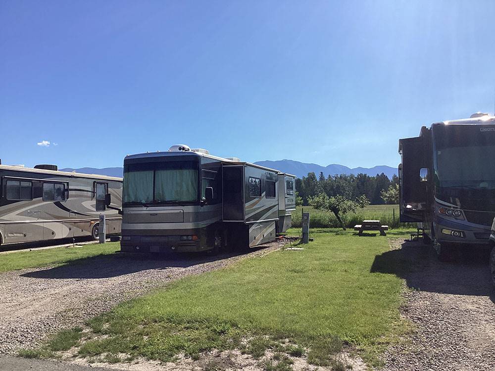 RVs parked in gravel sites at ROCKY MOUNTAIN 'HI' RV PARK AND CAMPGROUND