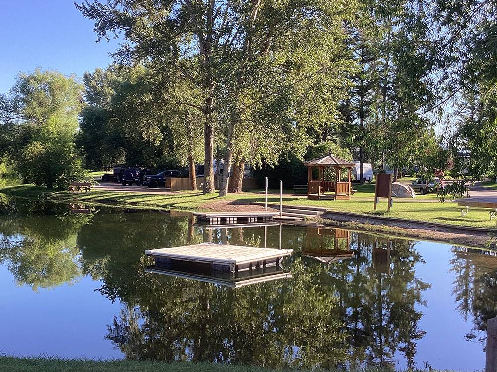A dock in the middle of the river at ROCKY MOUNTAIN 'HI' RV PARK AND CAMPGROUND