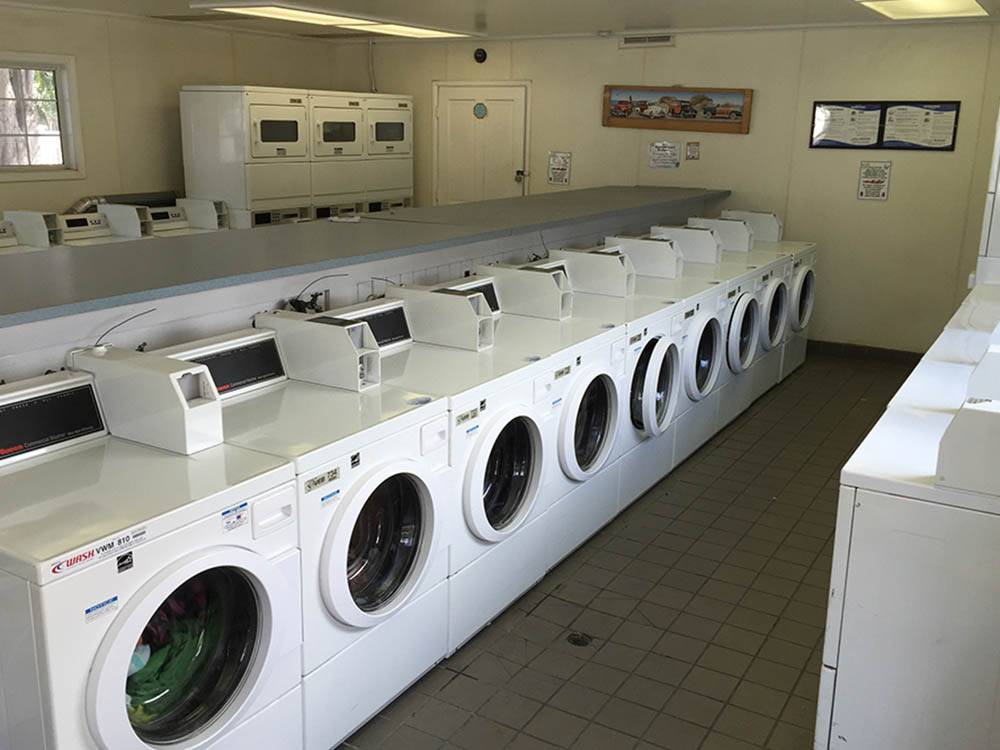 Laundry room with washer and dryers at PISMO COAST VILLAGE RV RESORT