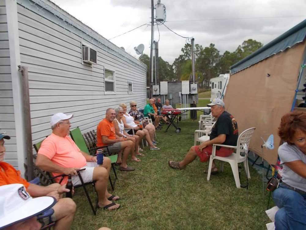 People relaxing outdoors at SUN N SHADE RV RESORT