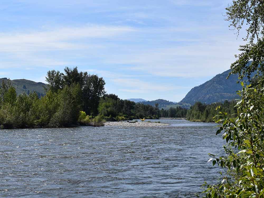 The river with mountains in the background at RIVERBEND RV PARK OF TWISP
