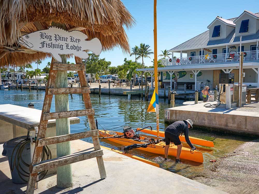 A man with an outrigger on a boat ramp at campground at BIG PINE KEY RESORT