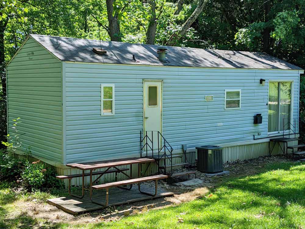 One of the rental manufactured homes at CAMP TOODIK FAMILY CAMPGROUND, CABINS & CANOE LIVERY