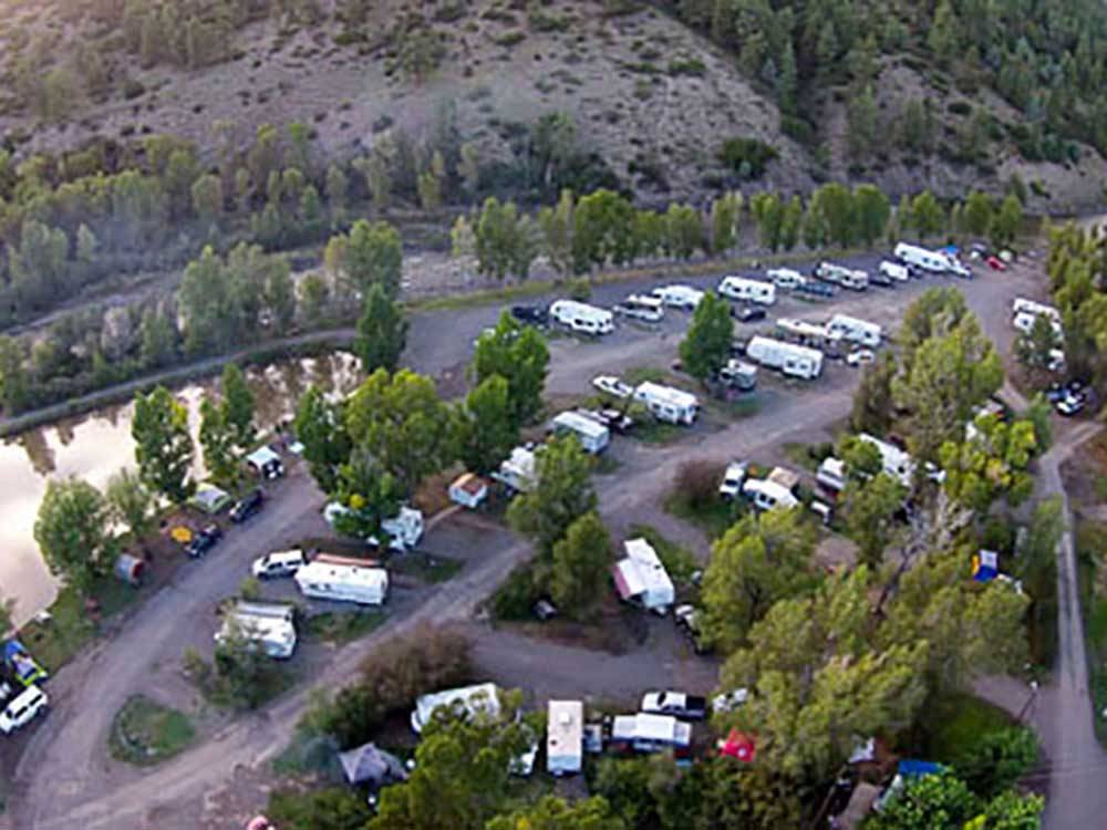 Aerial view of motorhomes and mountainside at PAGOSA RIVERSIDE CAMPGROUND