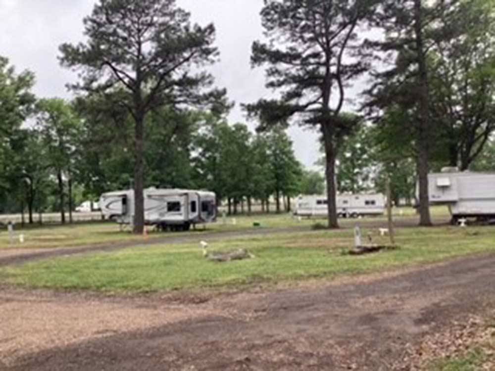 Some empty and occupied dirt sites at MORRILTON I40/107 RV PARK