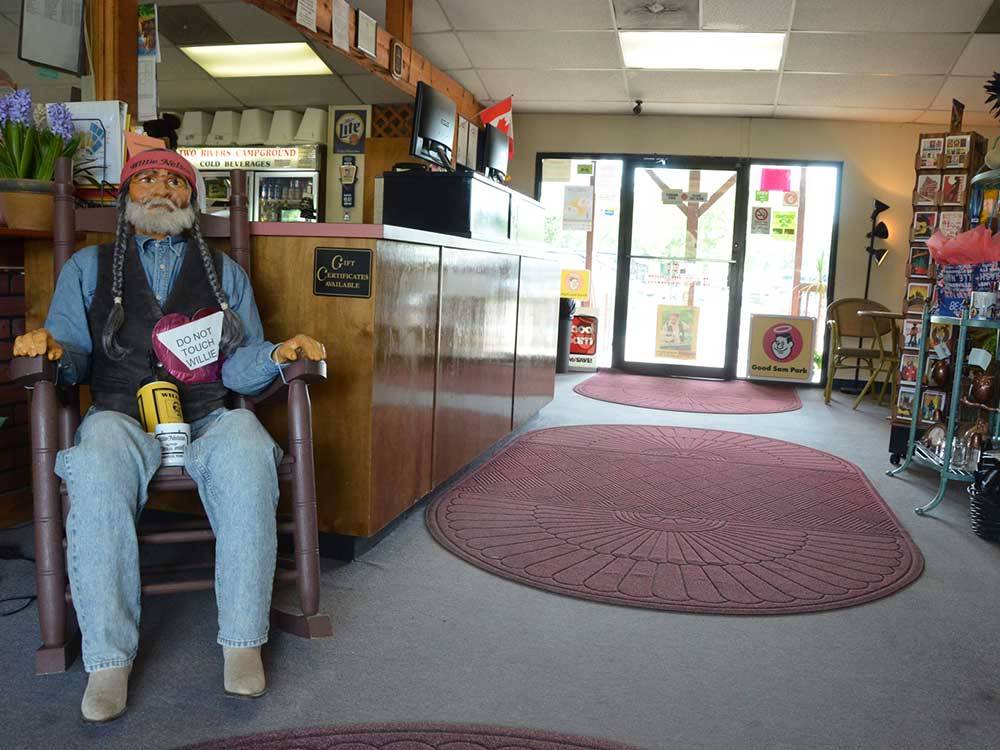 Office lobby with life size Willie Nelson doll at TWO RIVERS CAMPGROUND