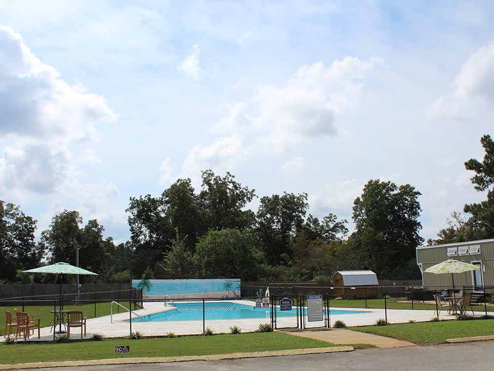 The fenced in swimming pool at CROSSROADS TRAVEL PARK