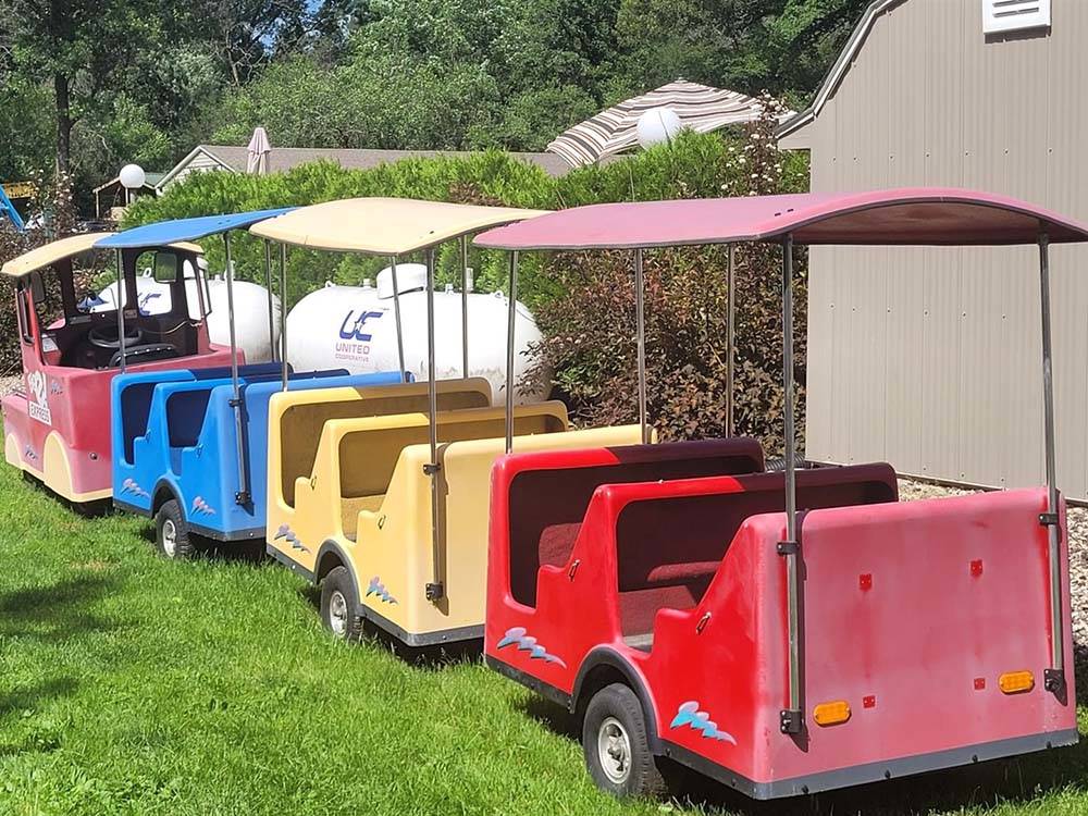 A colorful cart train at BARABOO RV RESORT BY RJOURNEY