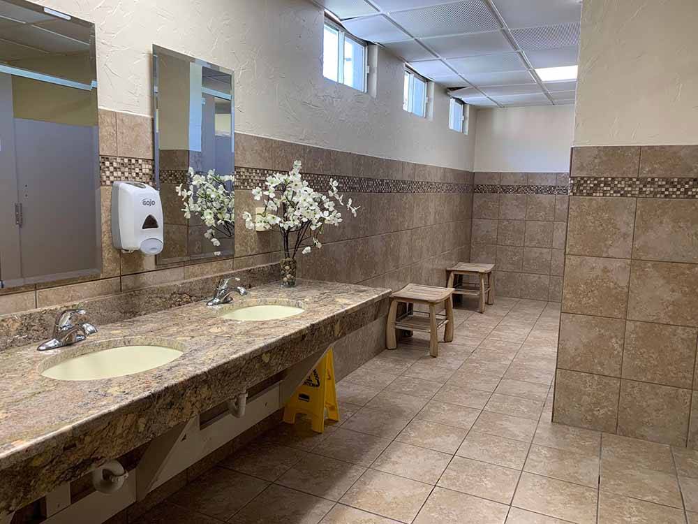 The inside of the clean restroom at FAYETTEVILLE RV RESORT & COTTAGES