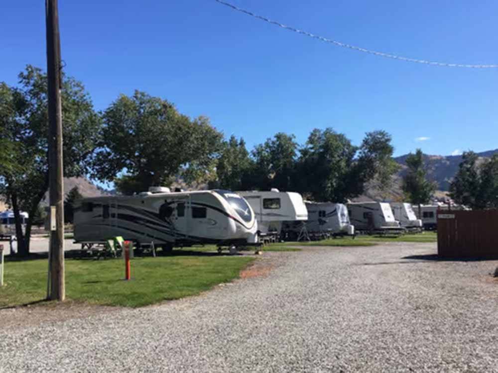 A row of trailers parked in sites at SUN OUTDOORS YELLOWSTONE NORTH