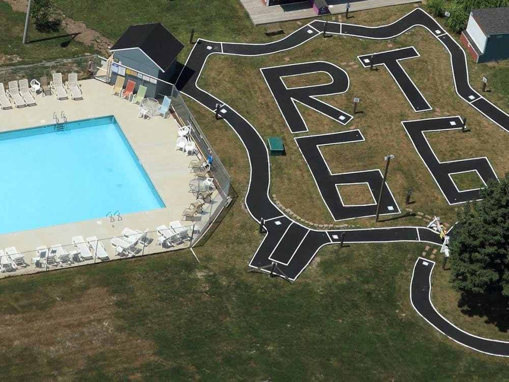 An aerial view of the swimming pool and track at DOUBLE J CAMPGROUND