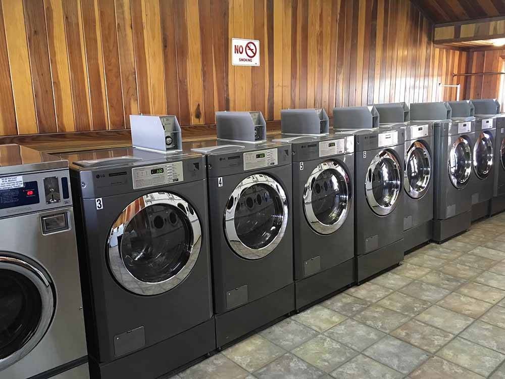 A row of brand new front loading washing machines at HITCHIN' POST RV PARK