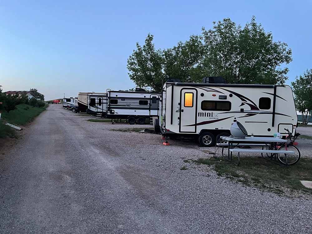 A row of gravel RV sites at MOUNTAIN VIEW RV PARK & CAMPGROUND